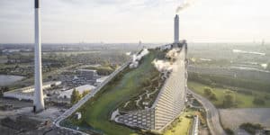 Imagem de um topo de um prédio com telhados verdes para simbolizar o Bjarke Ingels e sua explicação dobre o conceito de sustentabilidade hedonista na arquitetura